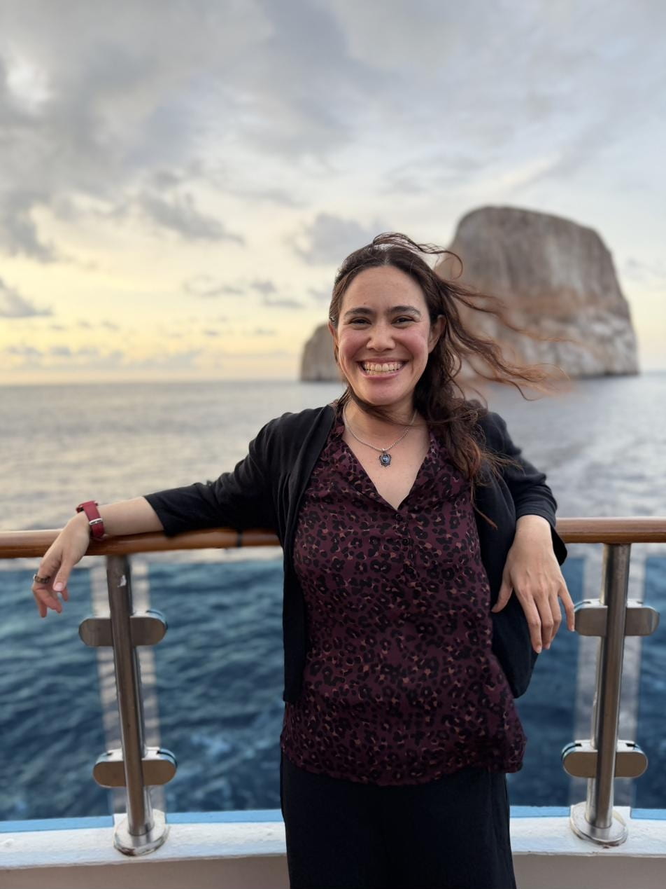 Kat Jong, MD in the Galápagos with Kicker Rock in the background